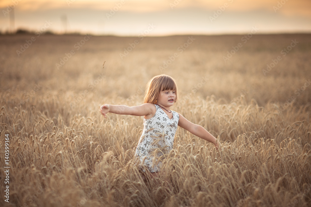 Funny girl dances in field with rye at sunset Funny girl dances in field with rye at sunset