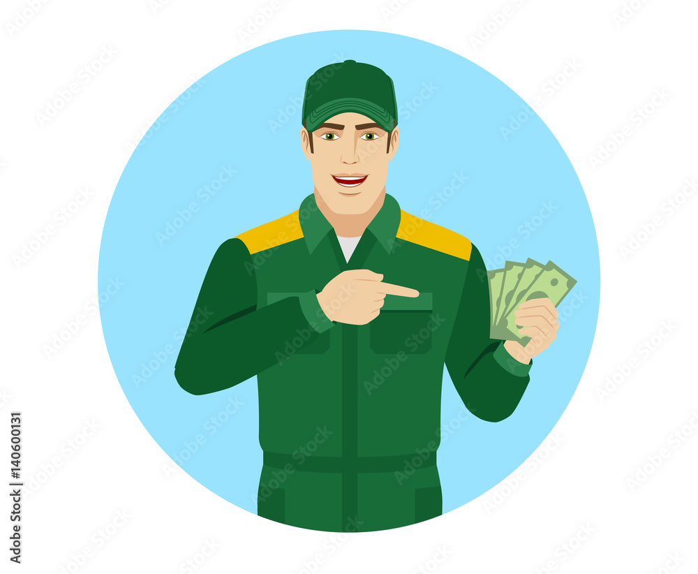 Man in uniform pointing at money in his hand Man in uniform pointing at money in his hand