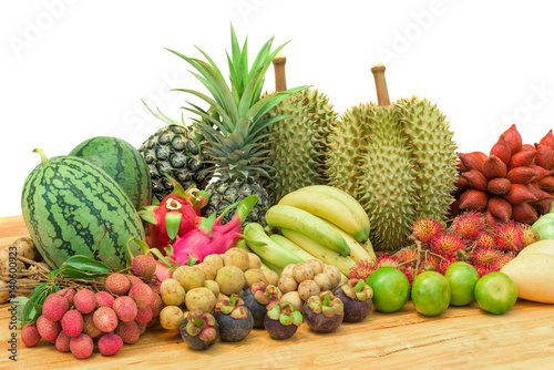 Fototapeta Naklejka Na Ścianę i Meble -  Fresh mixed fruits on wood table isolated on white background.