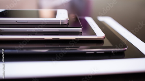 Several smartphones of different sizes. Comparison of screens of mobile phones.
