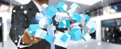 Businessman touching flying blue shiny cube 3D rendering