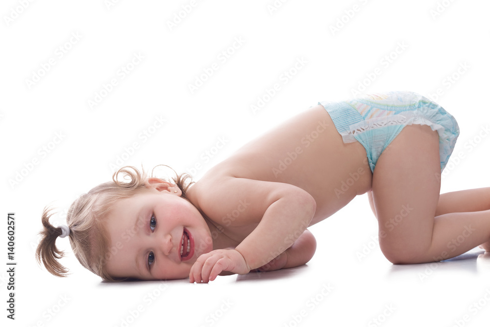 Obraz premium Baby girl wearing a diaper isolated on white
