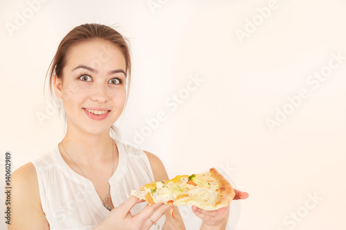 happy woman presents pizza on white background with copyspace