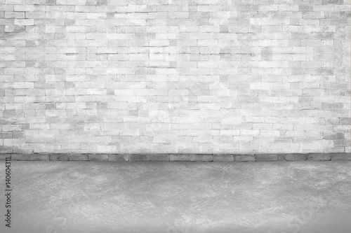 Abstract white interior of empty room with concrete wall and floor and picture frame of old vintage White brick wall