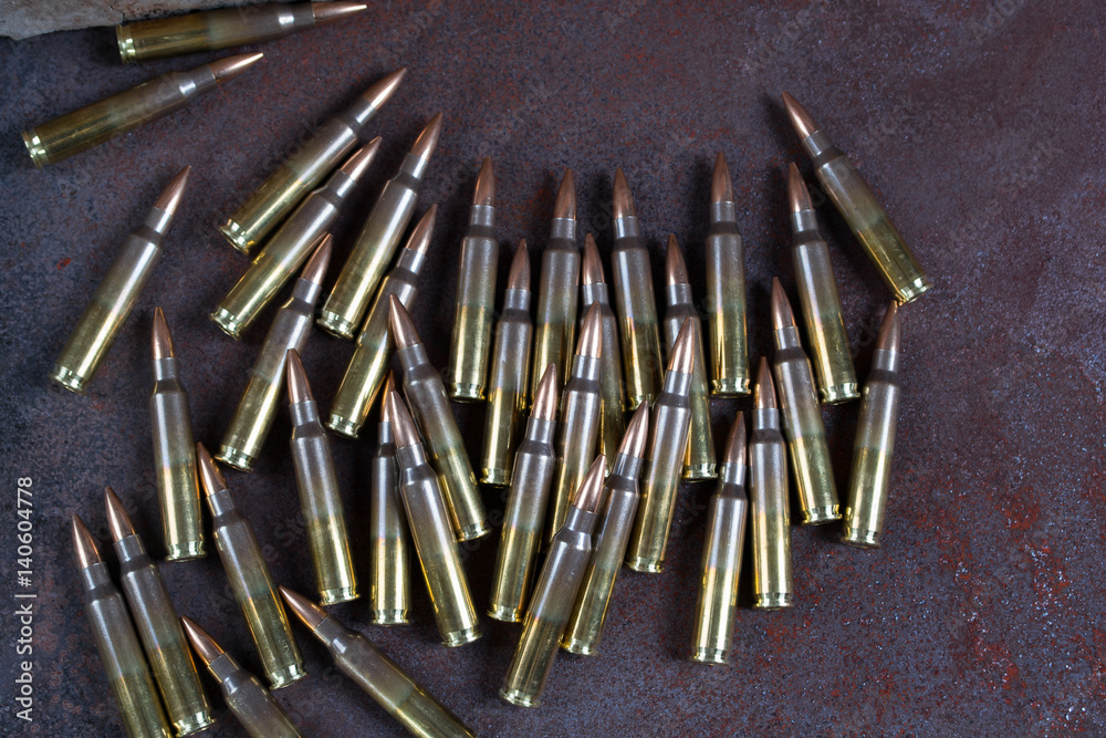 Group of ammunition on a rusted metal background Group of ammunition on a rusted metal background
