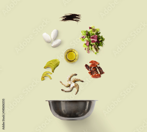 Cooking ingredients for healthy food, seafood salad, isolated on green © Prostock-studio