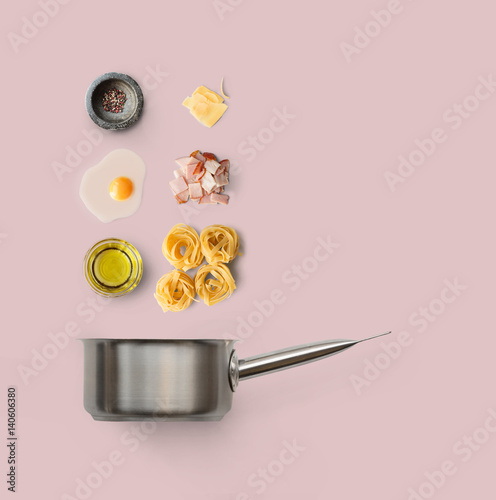 Cooking ingredients for italian food, carbonara, isolated on pink background
