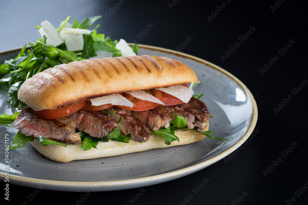 grilled steak medium fresh baked ciabatta sandwich beer
