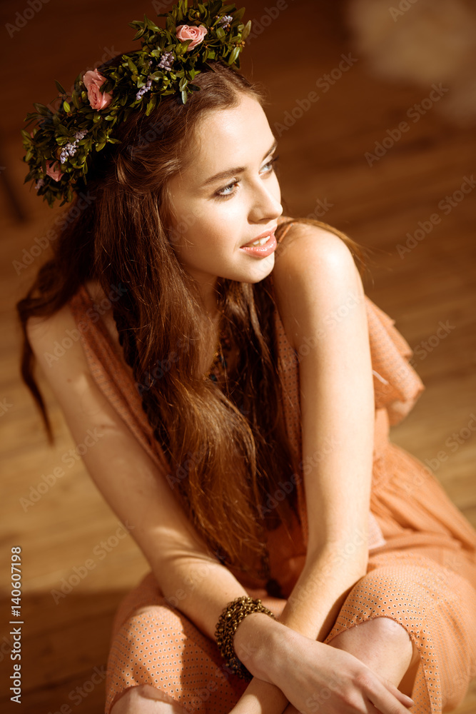 Young woman in floral wreath