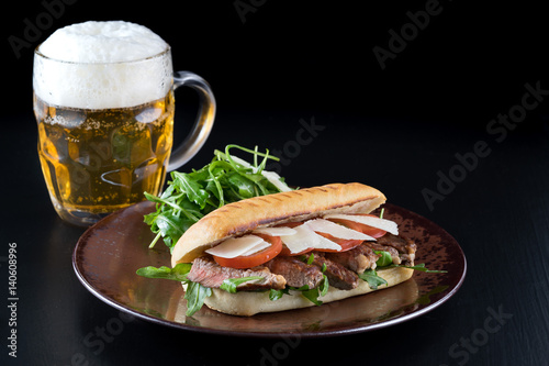 grilled steak medium fresh baked ciabatta sandwich beer