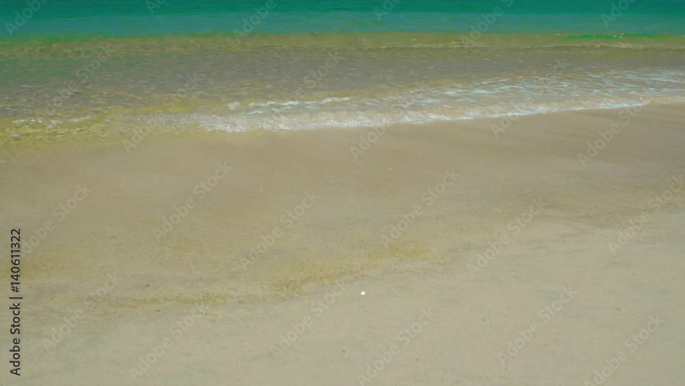 Surf on a tropical beach with yellow sand Surf on a tropical beach with yellow sand
