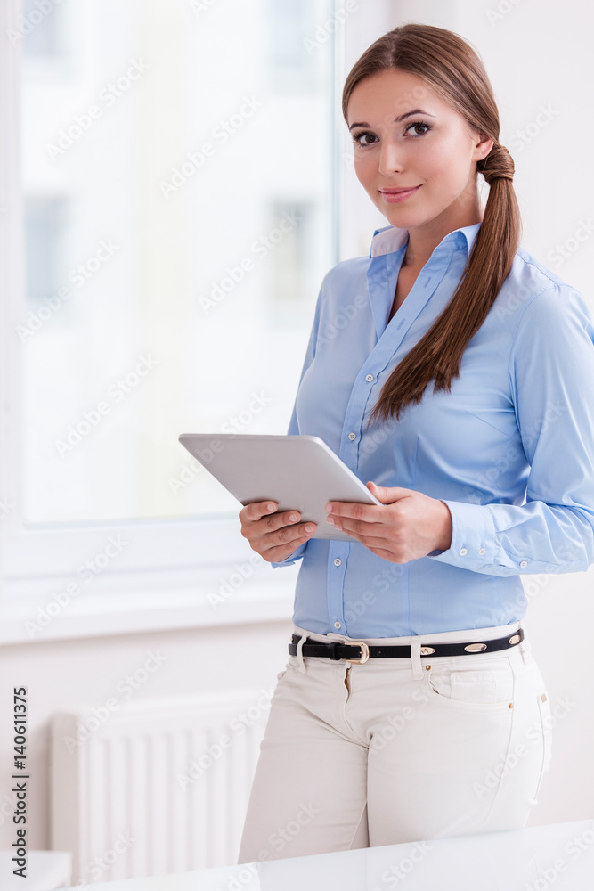 Beautiful businesswoman using tablet computer Beautiful businesswoman using tablet computer