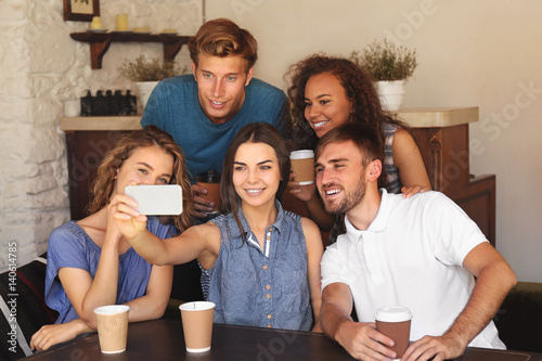 Happy friends taking selfie...