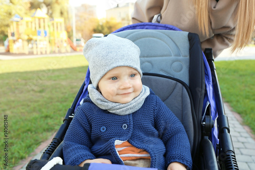 Cute little baby sitting in...