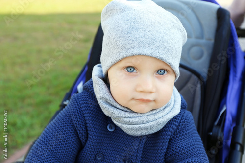 Cute little baby sitting in...