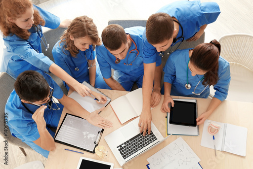 Medical students studying a...