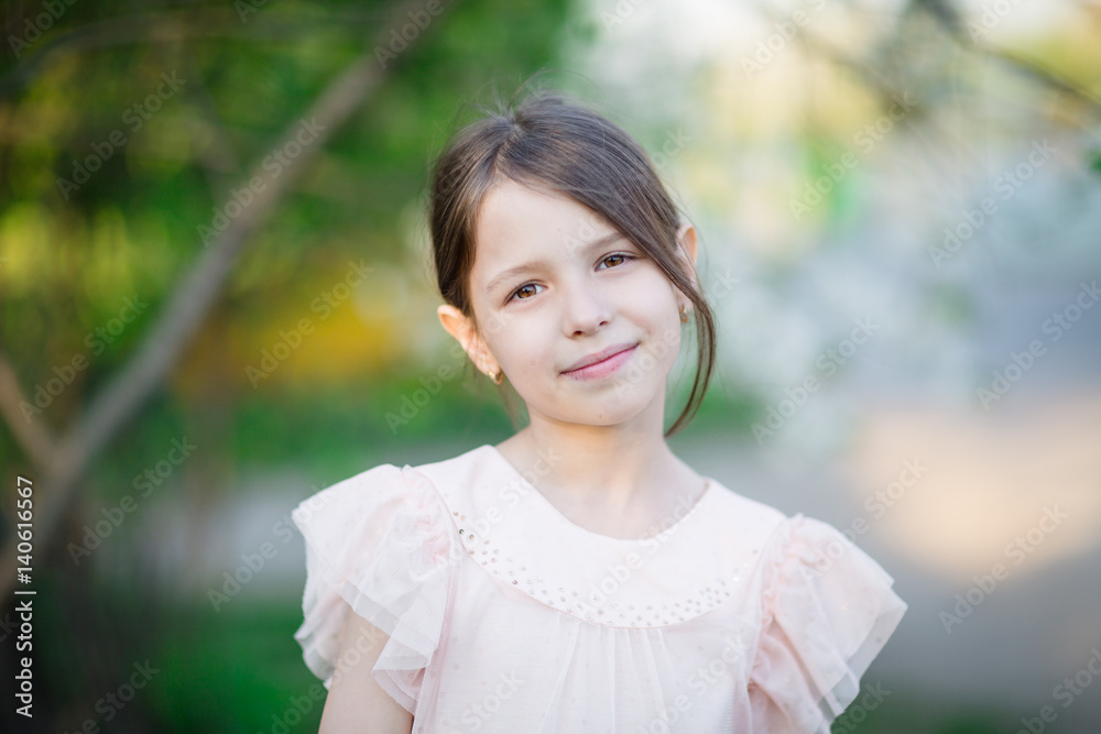 Portrait of nice little girl outdoors on warm and sunny spring day Portrait of nice little girl outdoors on warm and sunny spring day