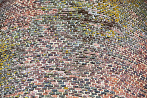 Close-up view of red cobbled tower