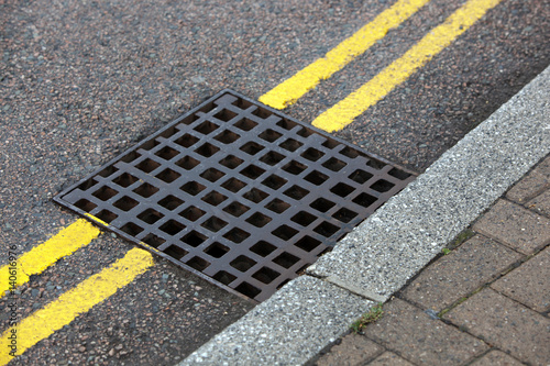 Photography Street drain over Double yellow line on street