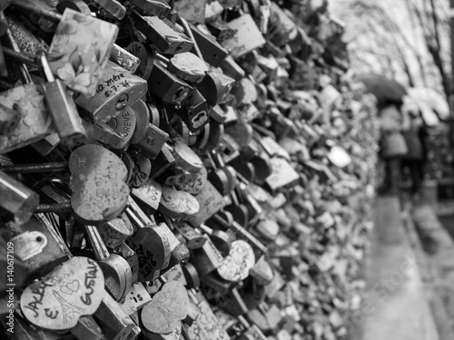 PARIS, FRANCE – MARCH 4TH 2017: A monochrome photograph of the love locks of the Pont Neuf bridge, Paris. 