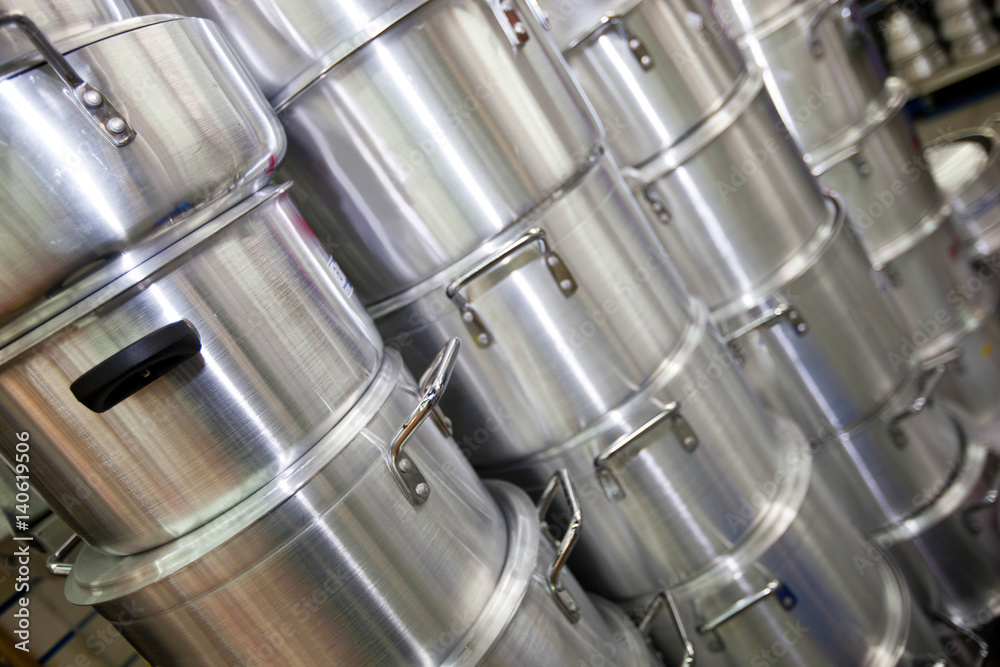 Stacked kitchen utensils in supermarket Stacked kitchen utensils in supermarket