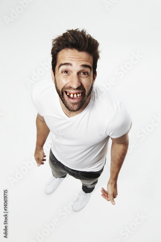 Guy with gap teeth smiling at camera