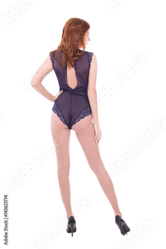 back view of sexy young beautiful woman in lace bodysuit lingerie posing isolated on white