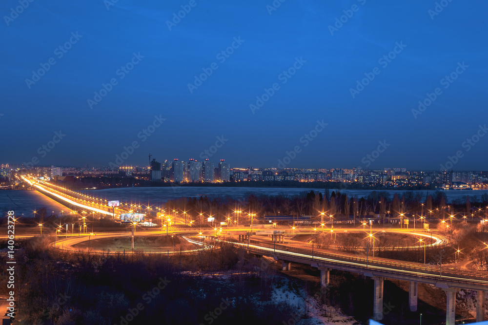 North Bridge and traffic roundabout in Voronezh, night cityscape aerial view