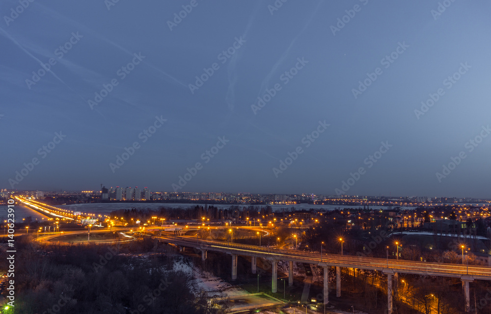 North Bridge and traffic roundabout in Voronezh, night cityscape aerial view 