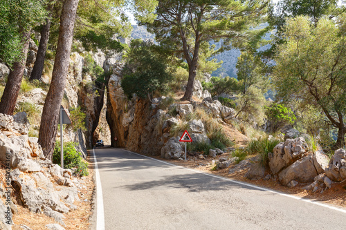 Bild auf Leinwand Mountain road between the rocks along the sea near the village Sa Calobra
