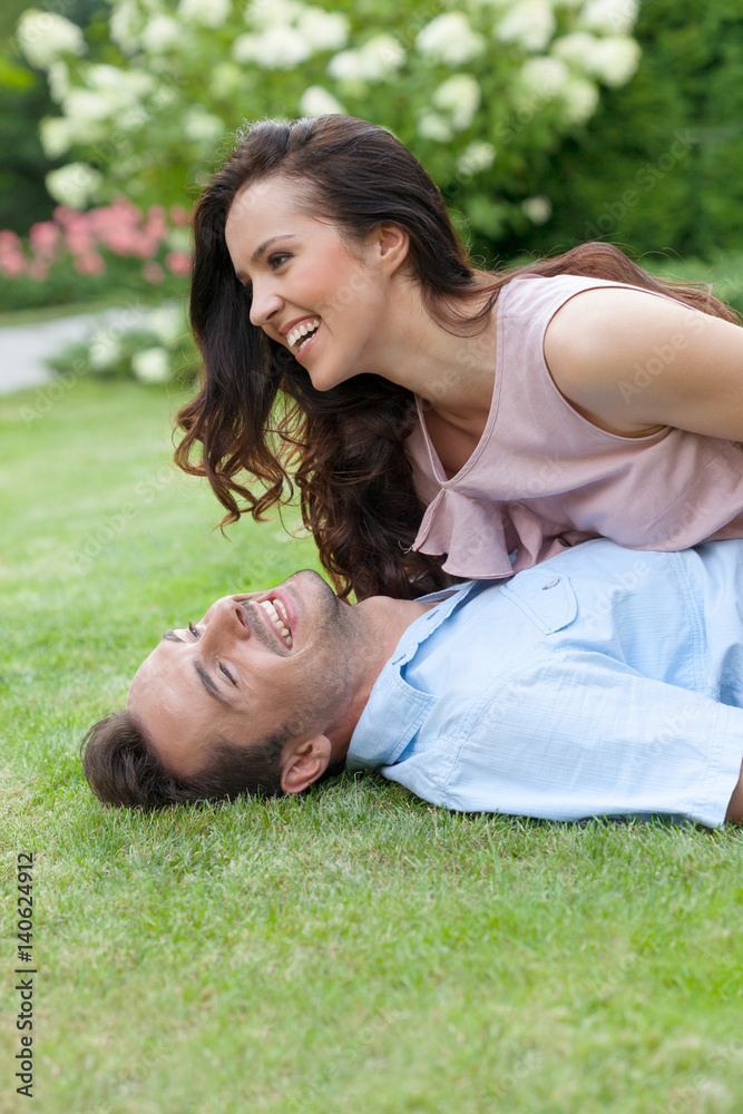 Playful young couple having leisure time in park Playful young couple having leisure time in park