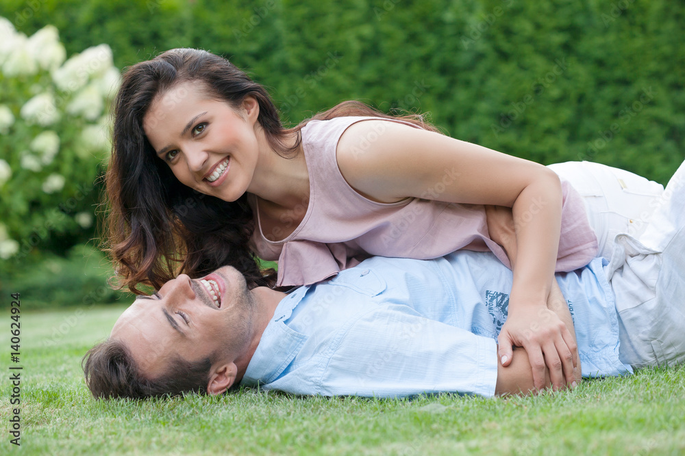 Playful young couple having leisure time in park Playful young couple having leisure time in park