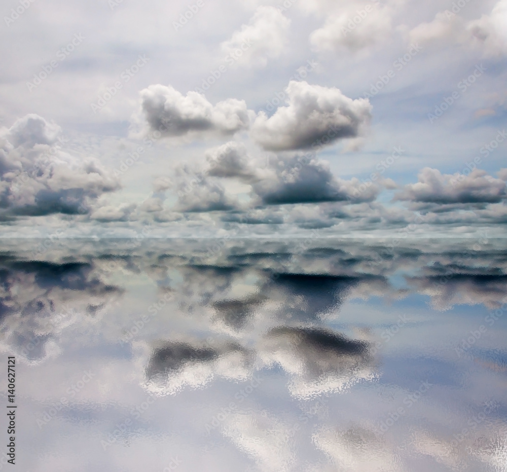 Cloudy sky with reflection on water