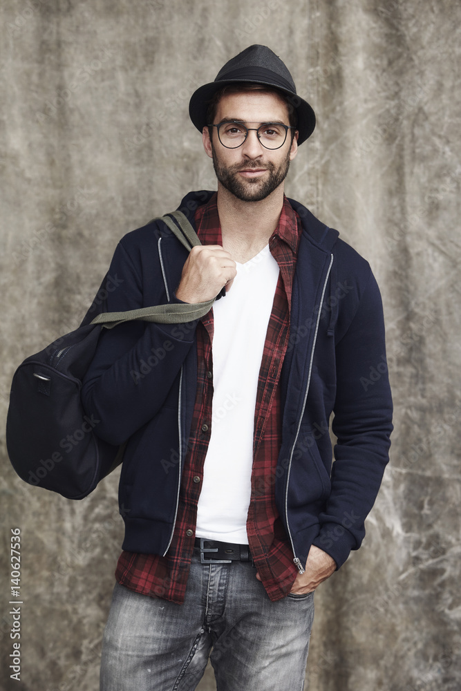 Dude with hat and bag in studio, portrait Dude with hat and bag in studio, portrait