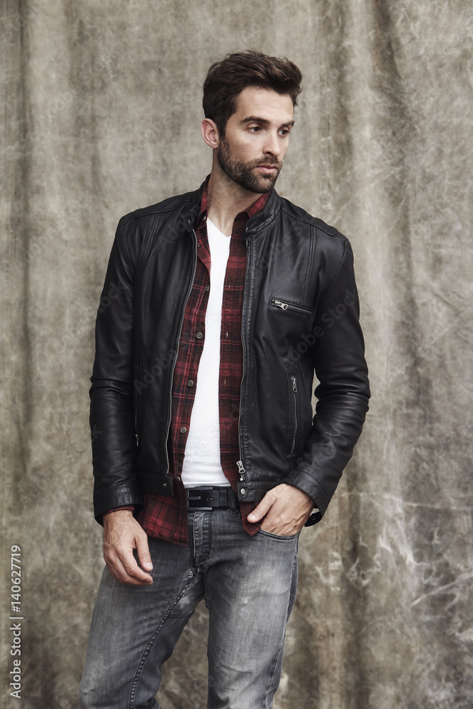 Leather jacket guy looking away, in studio Leather jacket guy looking away, in studio