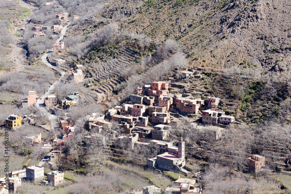 Obraz premium Modest traditional berber village with cubic houses in Atlas mountains, Morocco