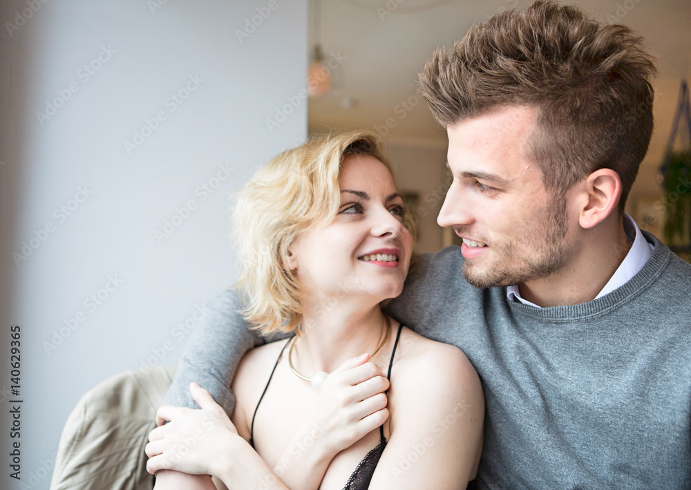 Happy young couple looking at each other in cafe Happy young couple looking at each other in cafe