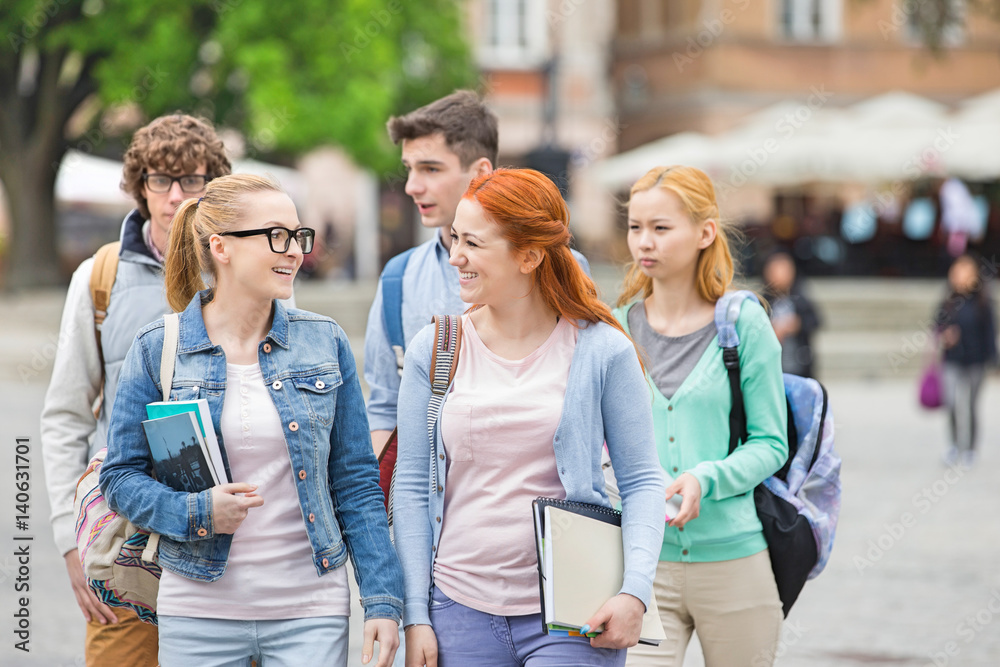 Group of college friends walking outdoors