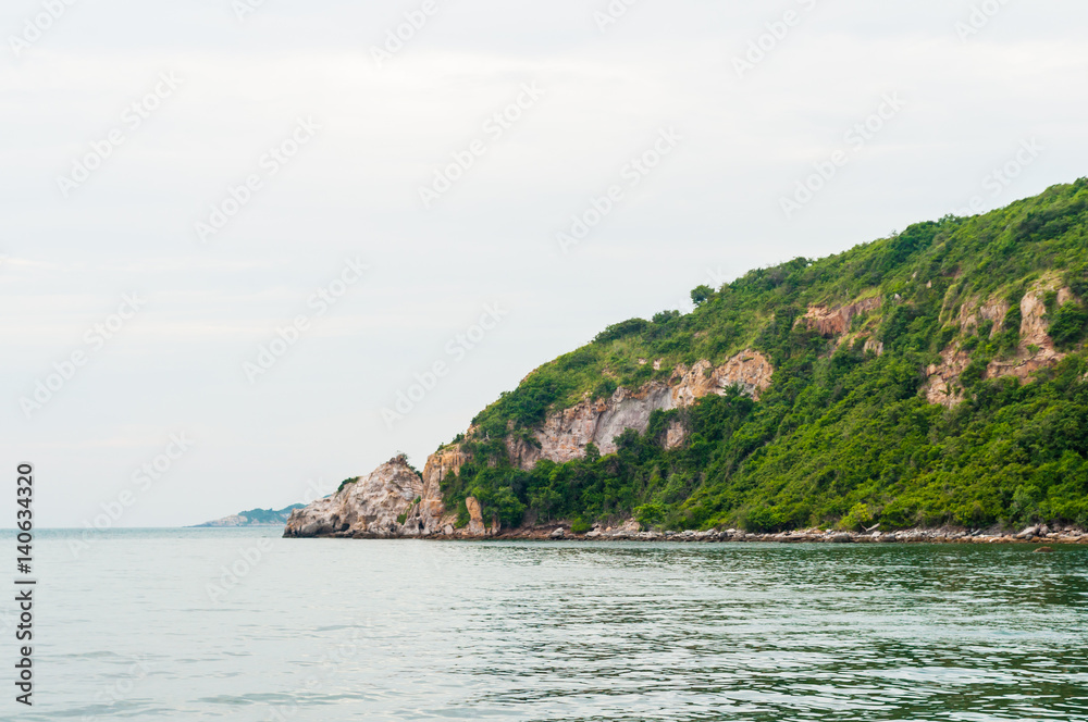 Landscape view to green island in ocean