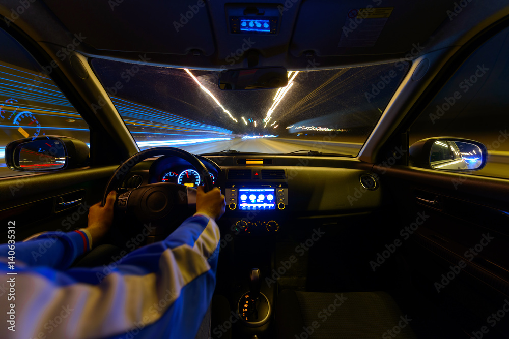 Night road view from inside car natural light street and other cars is motion blurred Night road view from inside car natural light street and other cars is motion blurred