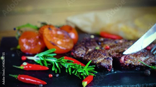 big tasty steak on stone plate