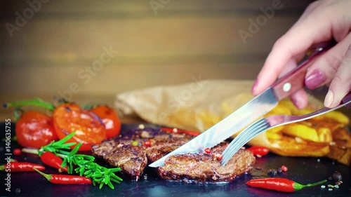 big tasty steak on stone plate