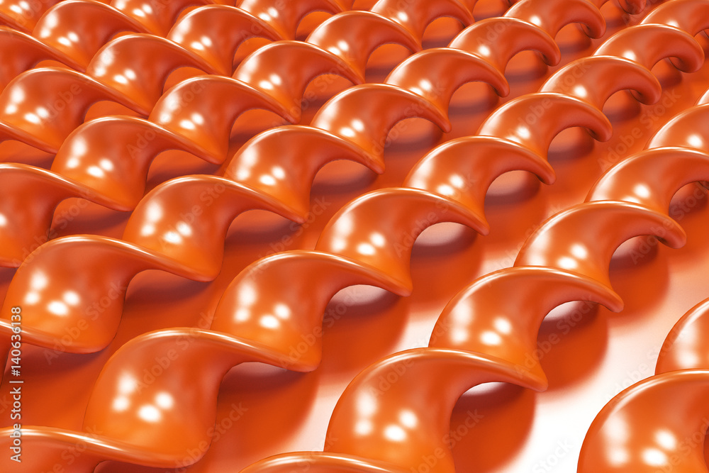 Obraz premium Orange plastic spiral sticks on orange background