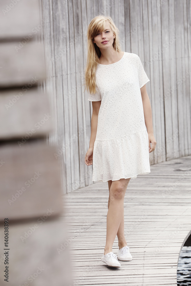 Beautiful women in white dress, looking at camera Beautiful women in white dress, looking at camera
