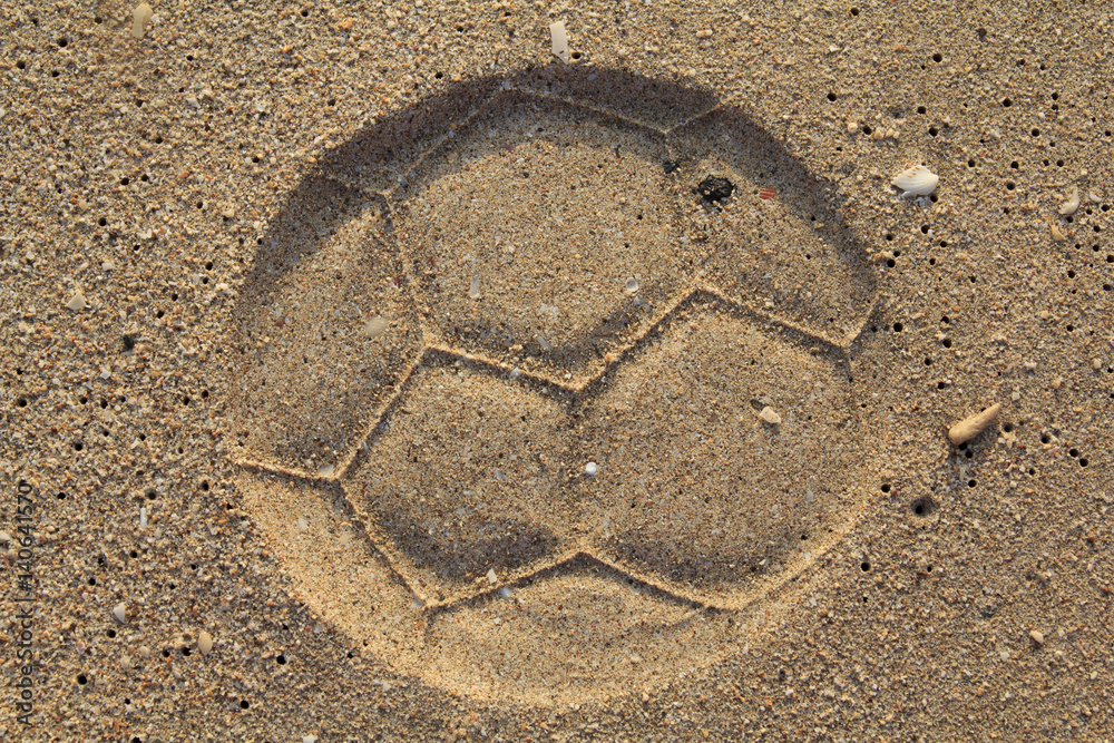 Fototapeta premium Soccer ball footprint on a sand with classical pentagon texture