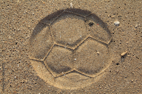 Soccer ball footprint on a sand with classical pentagon texture