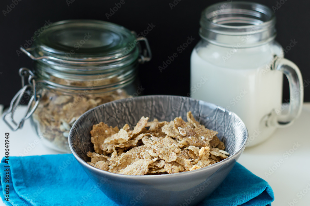 Bowl with crispy breakfast flakes with oats and milk. Healthy eating concept Bowl with crispy breakfast flakes with oats and milk. Healthy eating concept