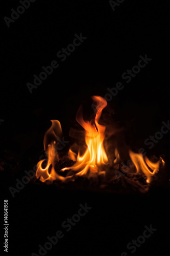 Burning and glowing charcoal with open hot flame texture