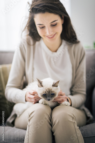 Woman cuddling her lovely cat