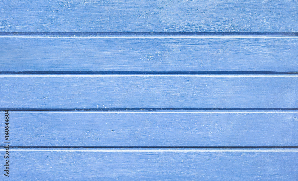 Fototapeta premium Cyan blue wood background and alternative construction material - Textured wooden panel in outer fence structure - Retro old fashioned backdrop pattern - Cobalt retro filter